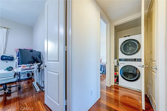 a view of a bedroom with washer and dryer
