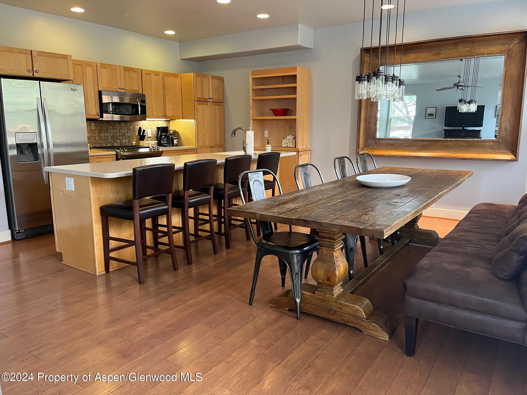 548 Evans Court Basalt, CO 81621 - Photo 1 of 24 a view of a dining room with furniture window and wooden floor