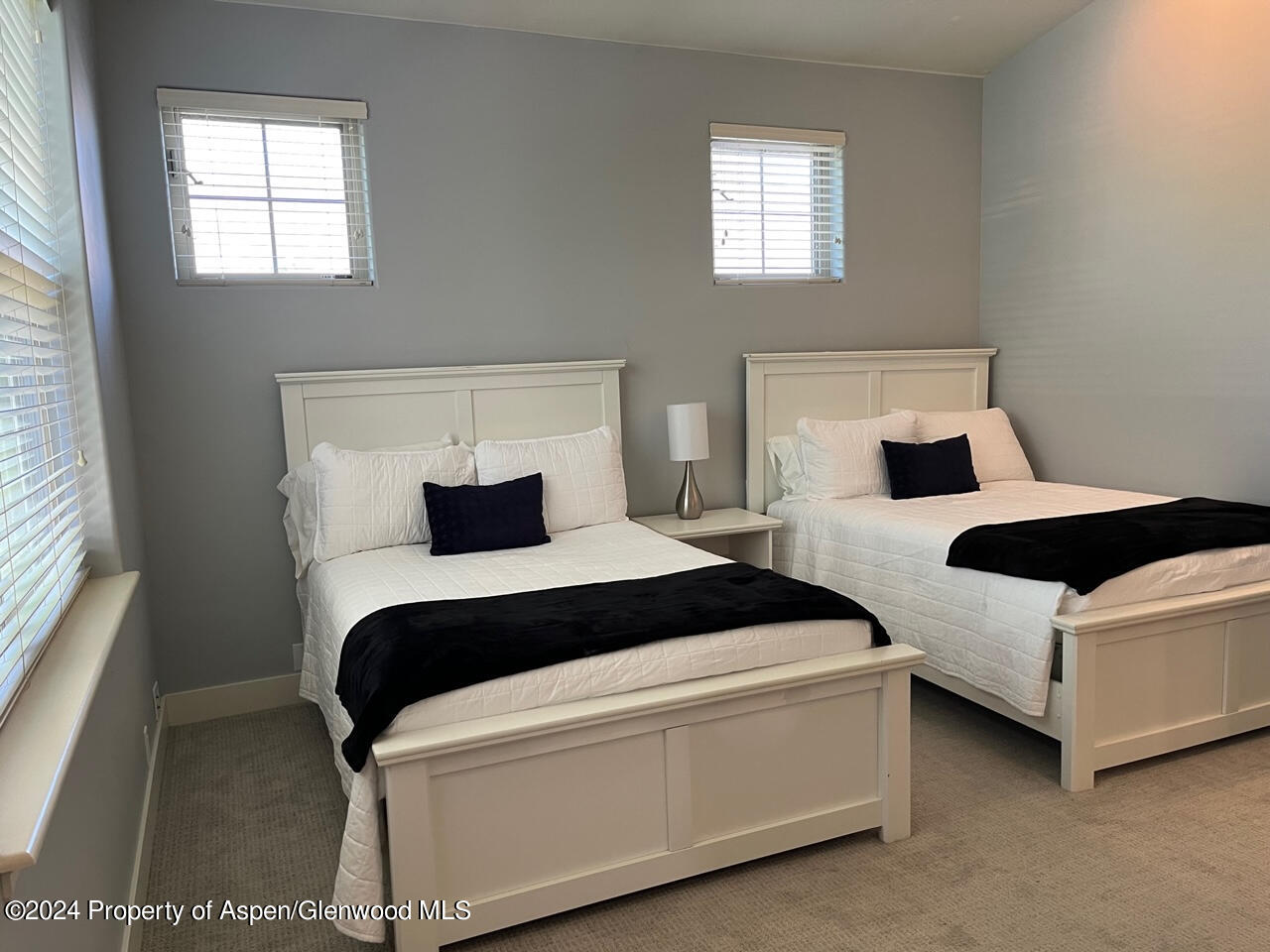548 Evans Court Basalt, CO 81621 - Photo 16 of 24 a bedroom with two beds and window