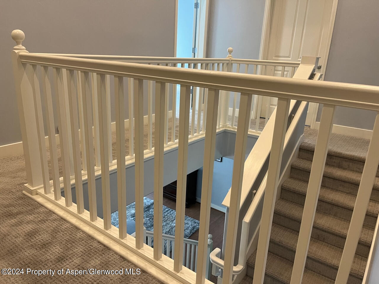 548 Evans Court Basalt, CO 81621 - Photo 18 of 24 a view of staircase with railing and white walls