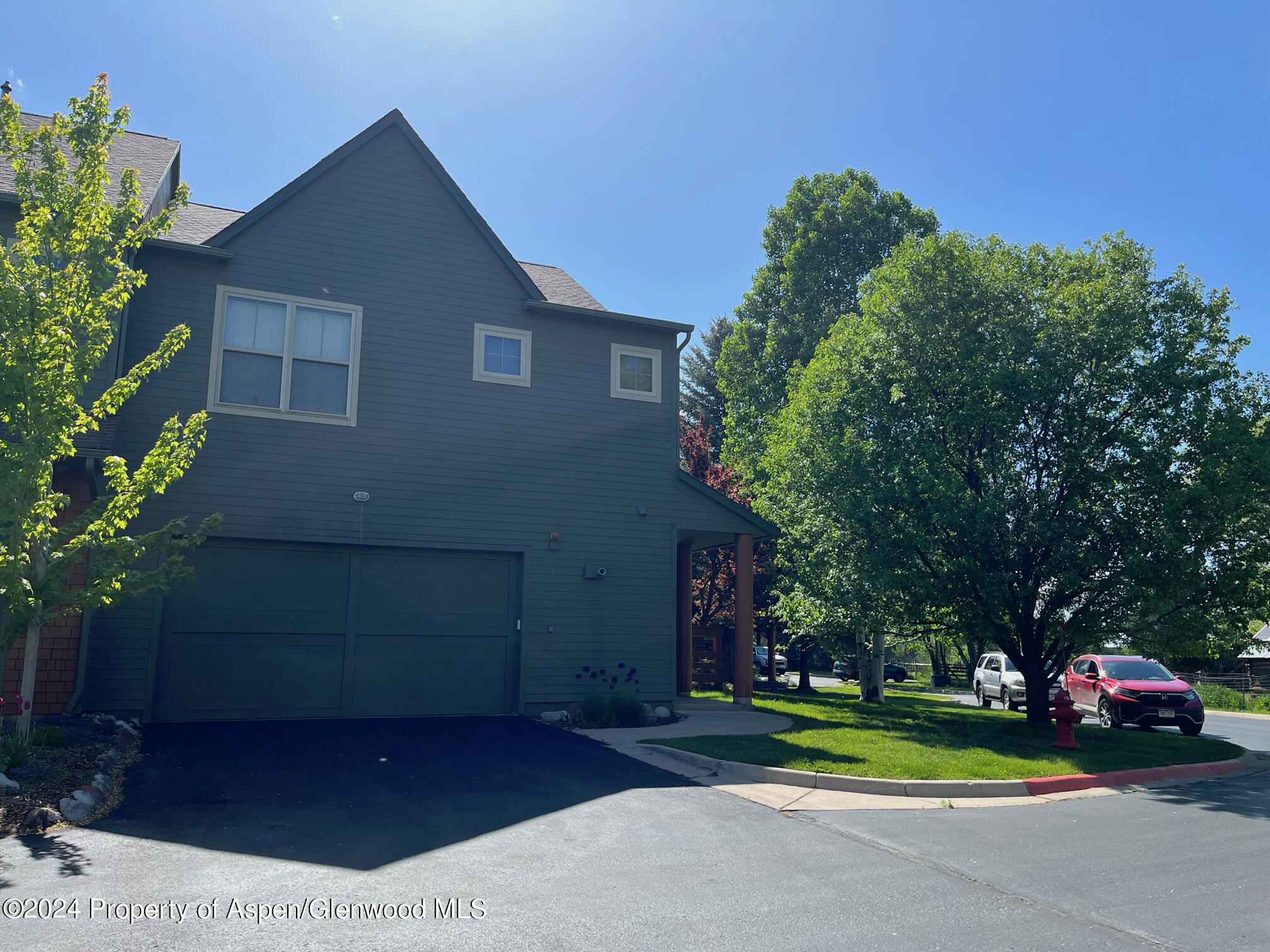 548 Evans Court Basalt, CO 81621 - Photo 22 of 24 a front view of a house with a yard and trees