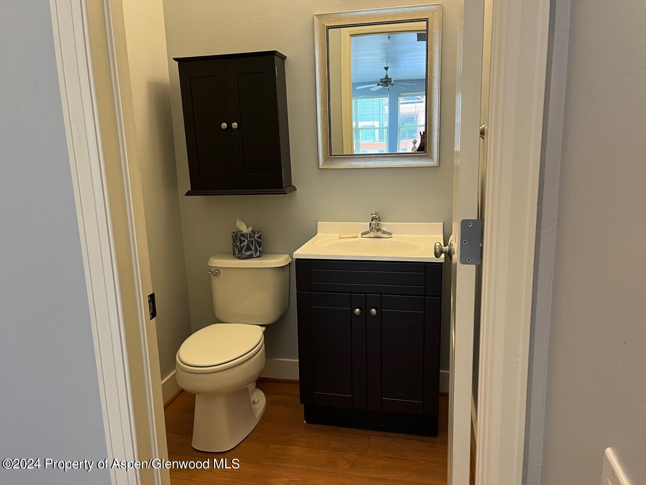 548 Evans Court Basalt, CO 81621 - Photo 8 of 24 a bathroom with a toilet sink and mirror