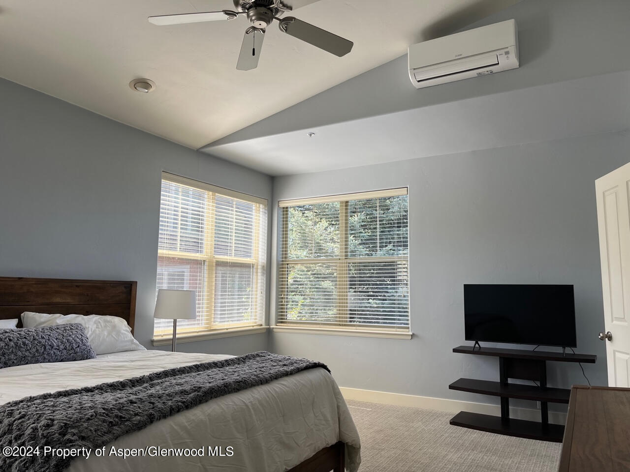 548 Evans Court Basalt, CO 81621 - Photo 9 of 24 a bedroom with a bed and a flat screen tv