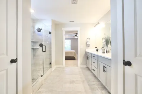 a bedroom with a bed and a view of bathroom