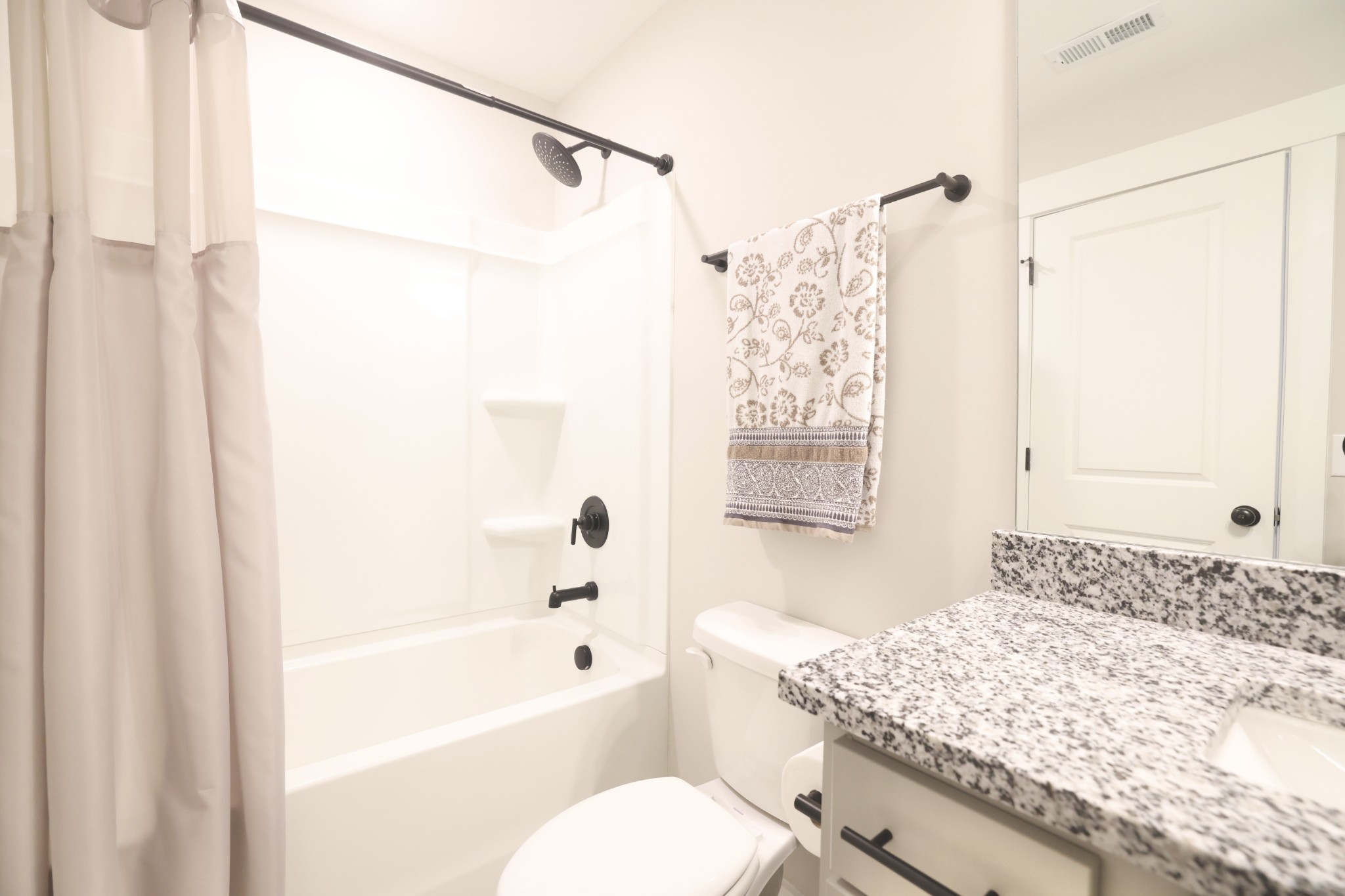 172 Cavalcade Loop Gallatin, TN 37066 - Photo 31 of 40 a bathroom with a granite countertop sink a toilet and shower