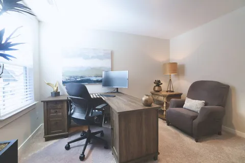 a living room with furniture and a table