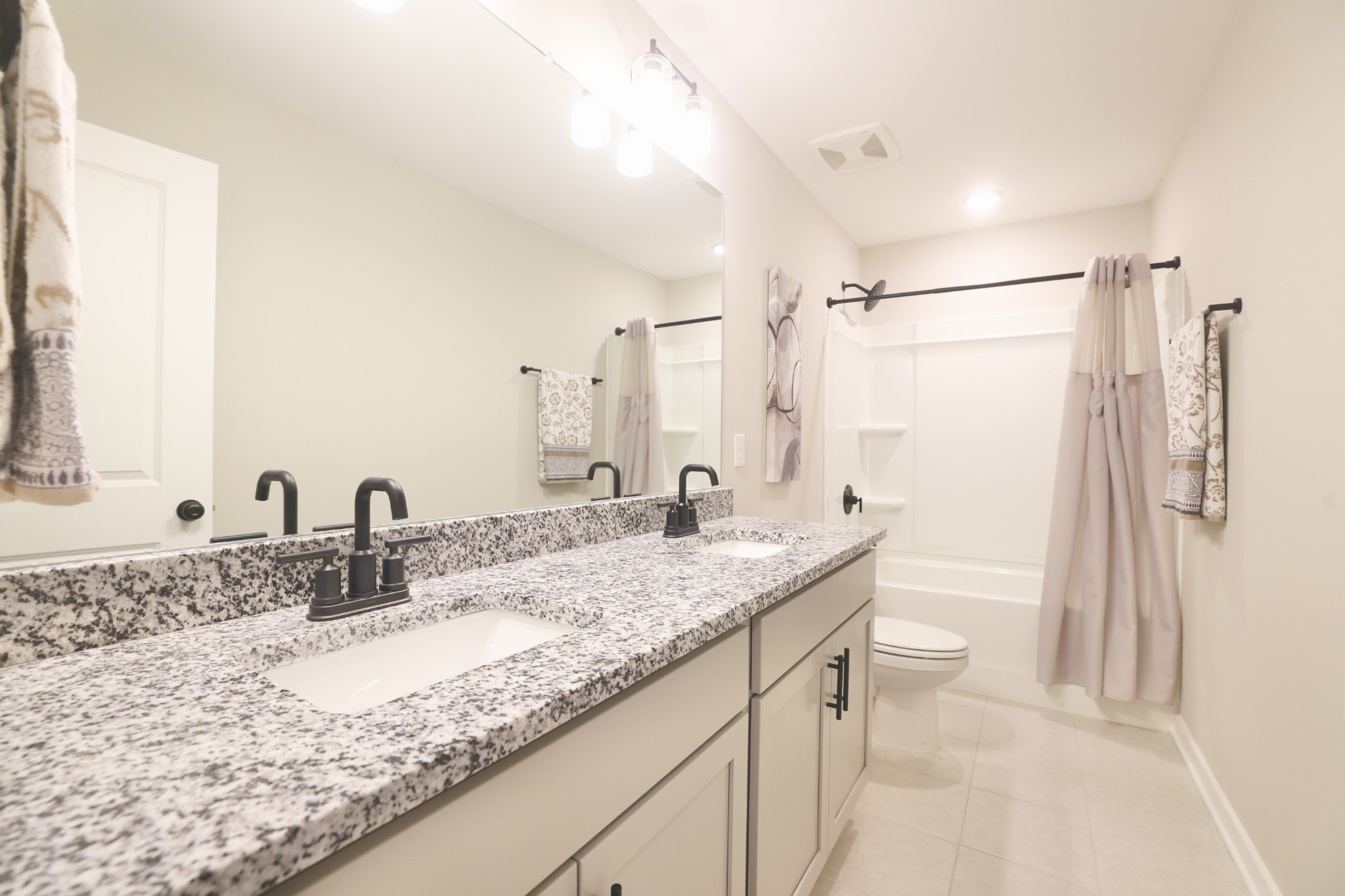 172 Cavalcade Loop Gallatin, TN 37066 - Photo 34 of 40 a bathroom with a granite countertop sink mirror and a