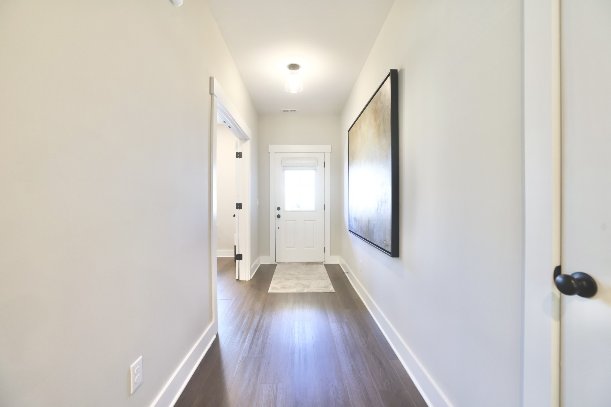 172 Cavalcade Loop Gallatin, TN 37066 - Photo 6 of 40 a view of a hallway with wooden floor