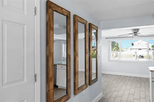 a kitchen with granite countertop a sink and cabinets