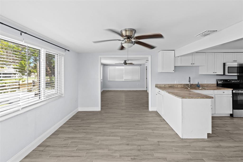 13916 Sommers Avenue Hudson, FL 34667 - Photo 13 of 46 a view of kitchen with sink microwave and stove