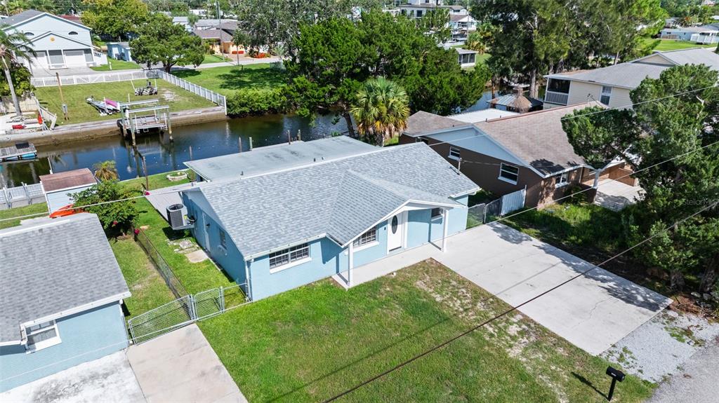 13916 Sommers Avenue Hudson, FL 34667 - Photo 2 of 46 an aerial view of a house with swimming pool garden and patio