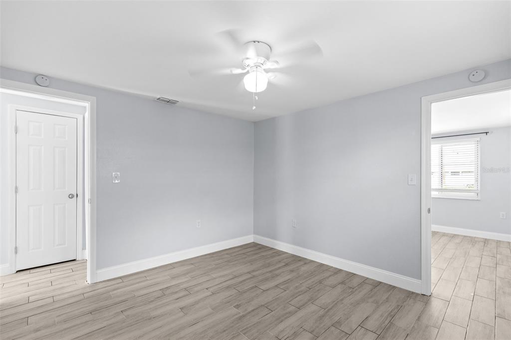 13916 Sommers Avenue Hudson, FL 34667 - Photo 24 of 46 wooden floor in an empty room with a window