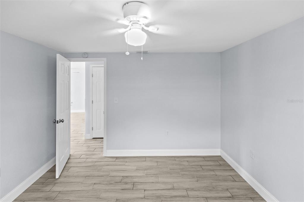 13916 Sommers Avenue Hudson, FL 34667 - Photo 26 of 46 a view of an empty room and wooden floor