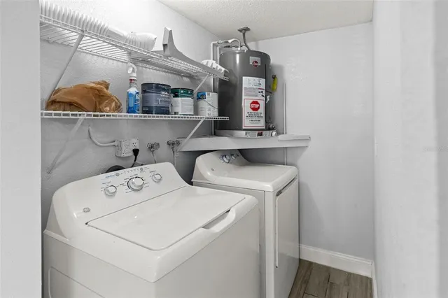 an aerial view of a house with a yard table and chairs