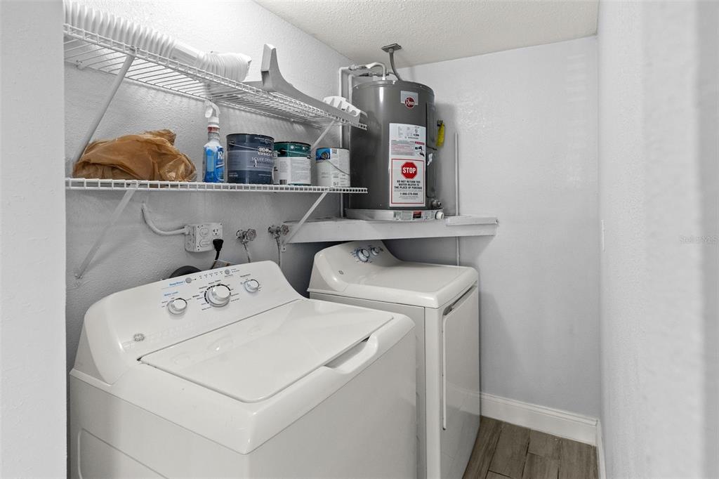 13916 Sommers Avenue Hudson, FL 34667 - Photo 32 of 46 a utility room with dryer and washer