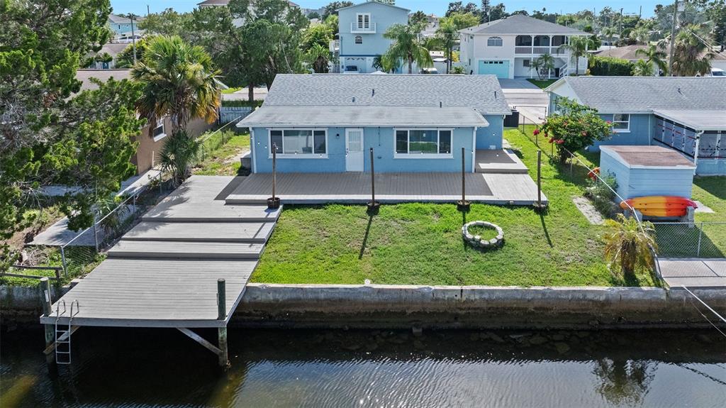 13916 Sommers Avenue Hudson, FL 34667 - Photo 33 of 46 an aerial view of a house with a yard table and chairs
