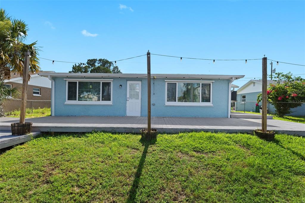 13916 Sommers Avenue Hudson, FL 34667 - Photo 34 of 46 a front view of a house with garden
