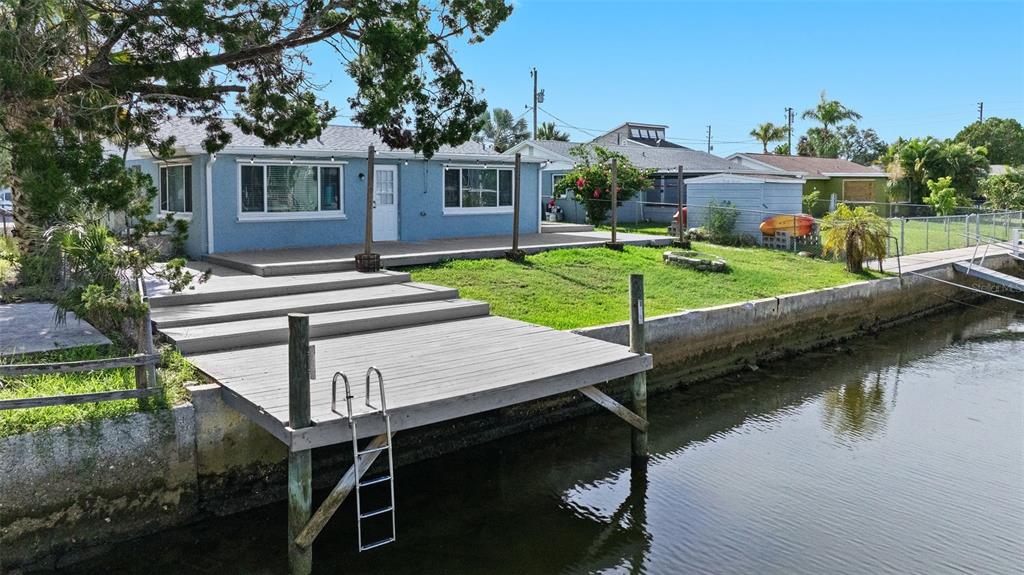13916 Sommers Avenue Hudson, FL 34667 - Photo 35 of 46 a view of house with yard and lake view