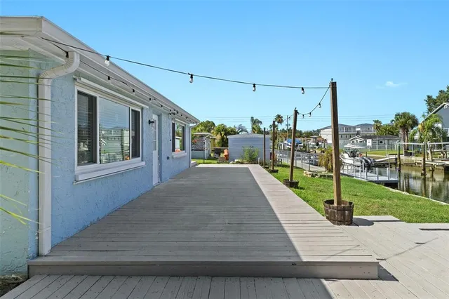 an aerial view of a house with a big yard