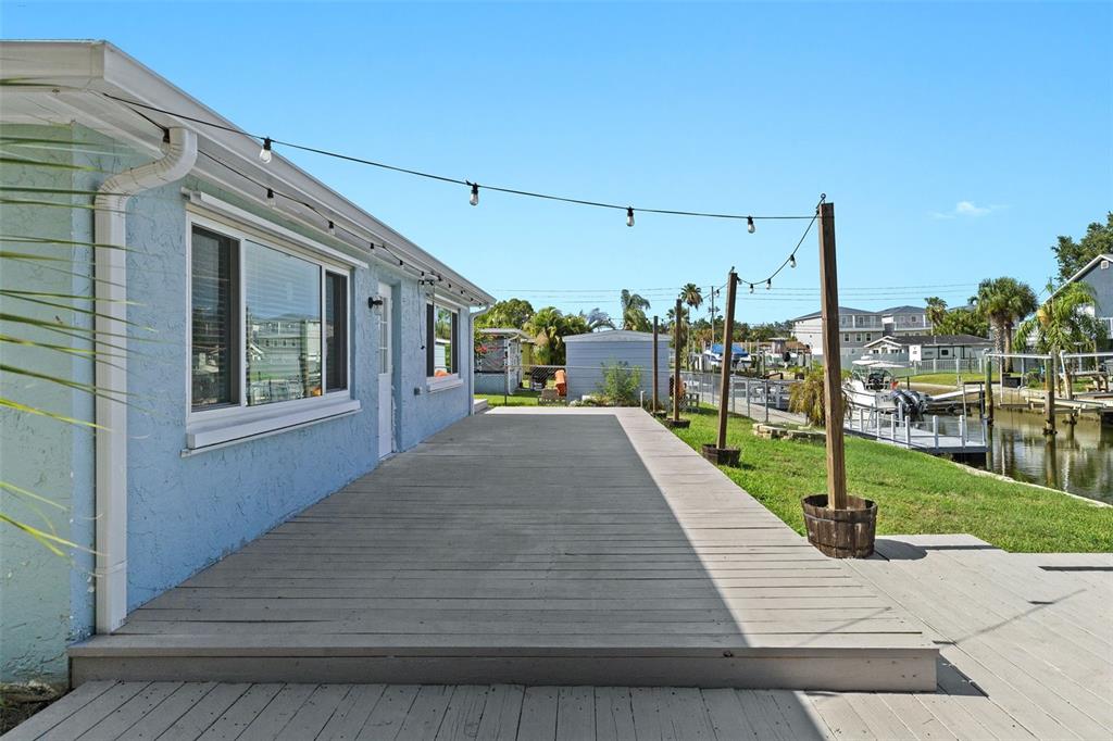 13916 Sommers Avenue Hudson, FL 34667 - Photo 38 of 46 a view of a house with backyard and porch