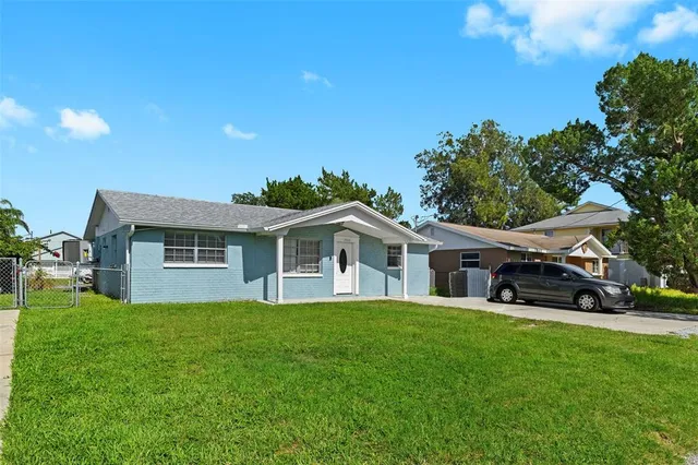 a aerial view of a house with a yard