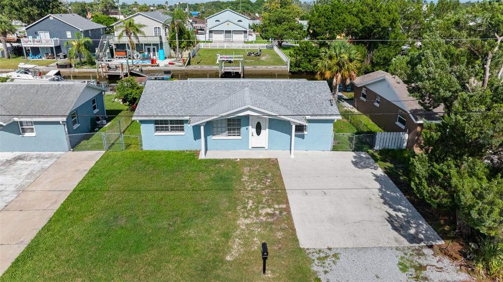 13916 Sommers Avenue Hudson, FL 34667 - Photo 43 of 46 a aerial view of a house with a yard