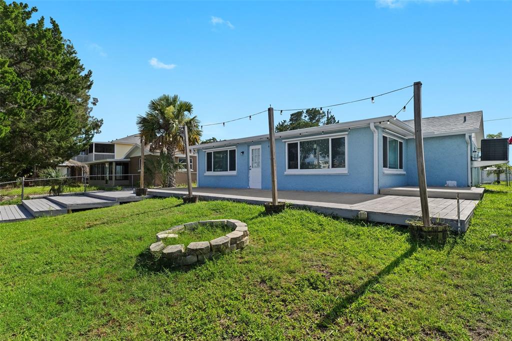 13916 Sommers Avenue Hudson, FL 34667 - Photo 45 of 46 a house view with a garden space