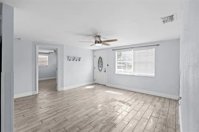 a kitchen with a refrigerator a sink and a stove top oven