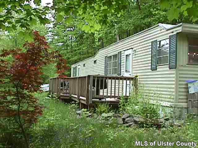 148 Rudy Frank Rd Extension Shandaken, NY 12480 - Photo 2 of 10 a view of a house with a small yard and wooden fence