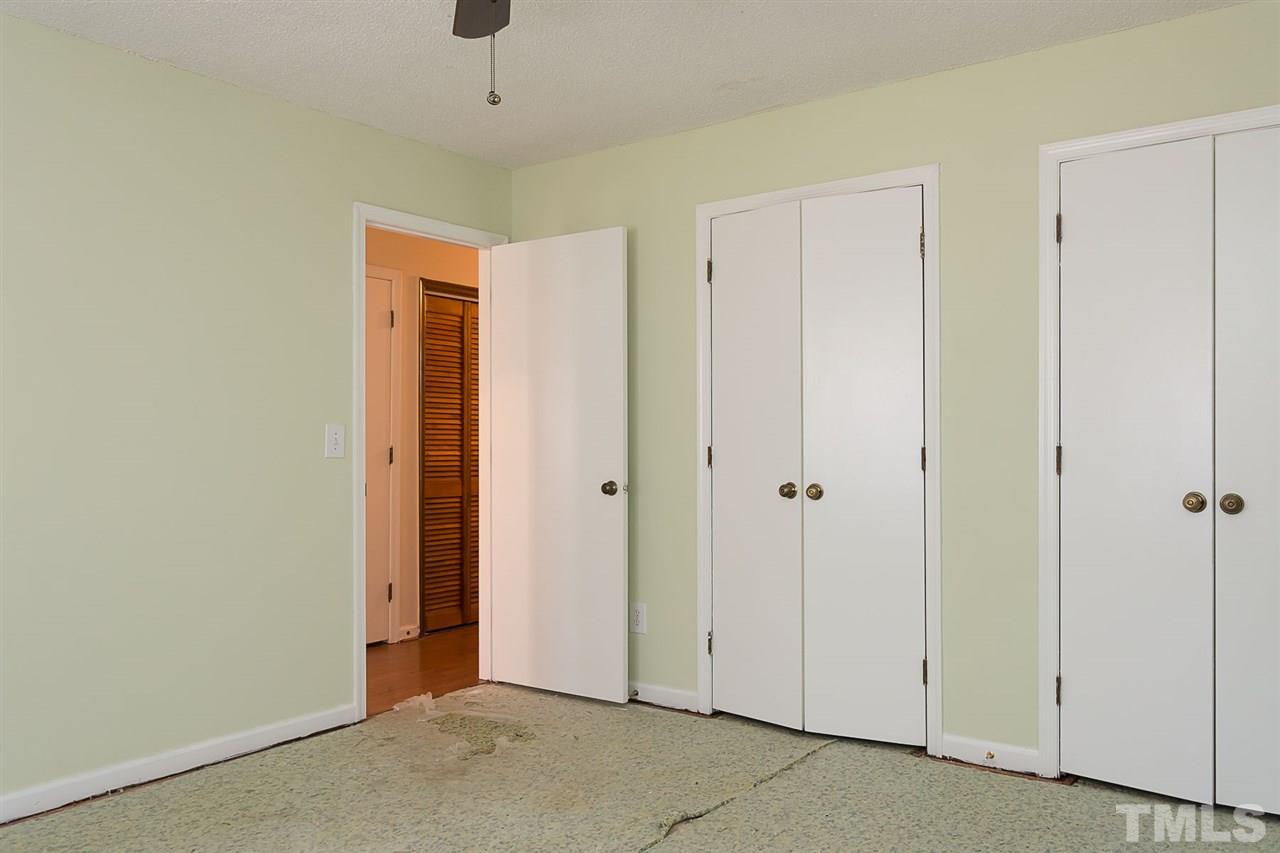7606 Ladden Court Raleigh, NC 27615 - Photo 14 of 16 a view of a hallway with closet area