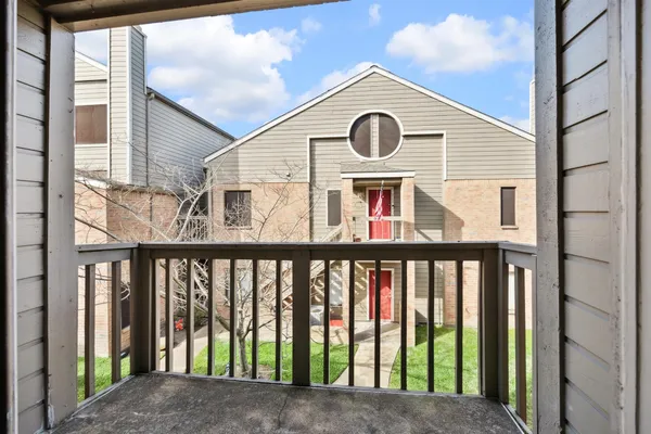 a view of a brick house with a windows