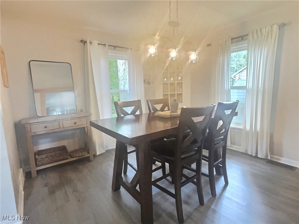 3688 Easton Road Norton, OH 44203 - Photo 13 of 37 Dining room with dark hardwood / wood-style flooring and a chandelier