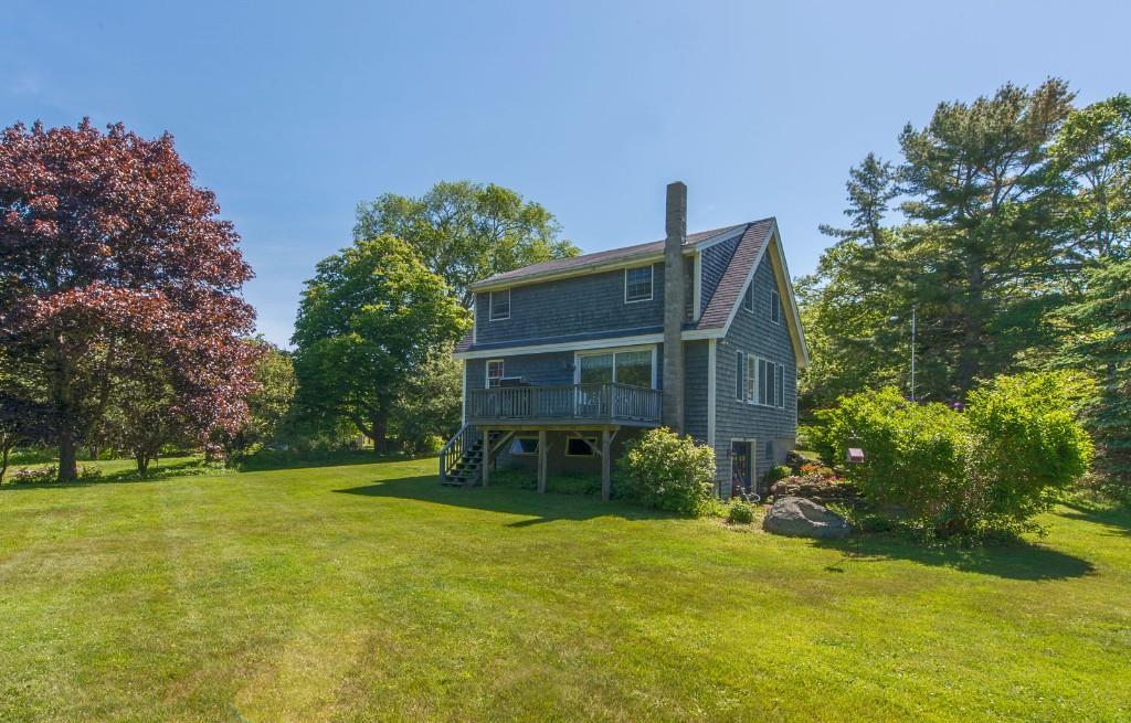 581 Ocean Point Road Boothbay, ME 04544 - Photo 4 of 25 Expansive rear yard with deck off...