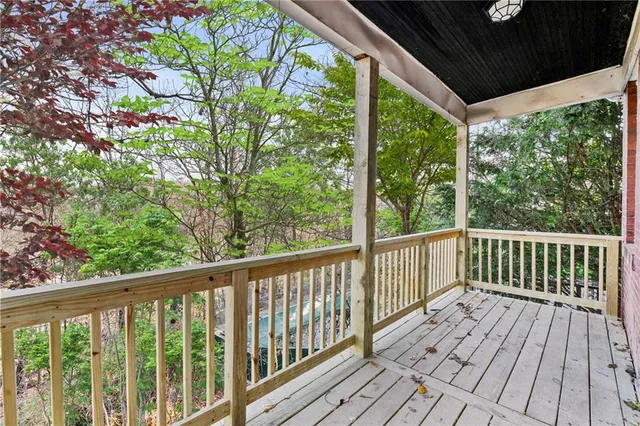 a view of balcony with wooden floor