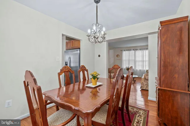 a view of a dining room with furniture and chandelier