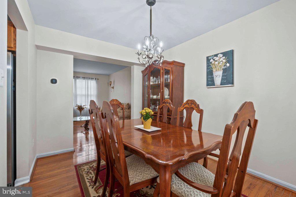 4305 Silver Spring Road Perry Hall, MD 21236 - Photo 13 of 48 a view of a dining room with furniture and wooden floor