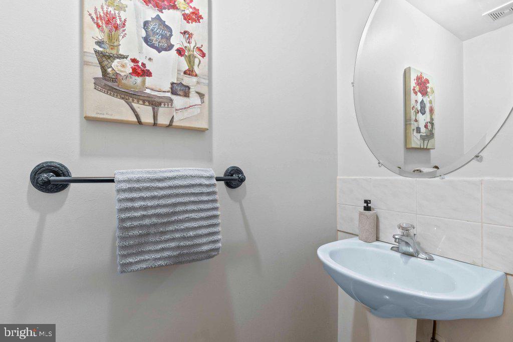 4305 Silver Spring Road Perry Hall, MD 21236 - Photo 14 of 48 a bathroom with a sink and a mirror