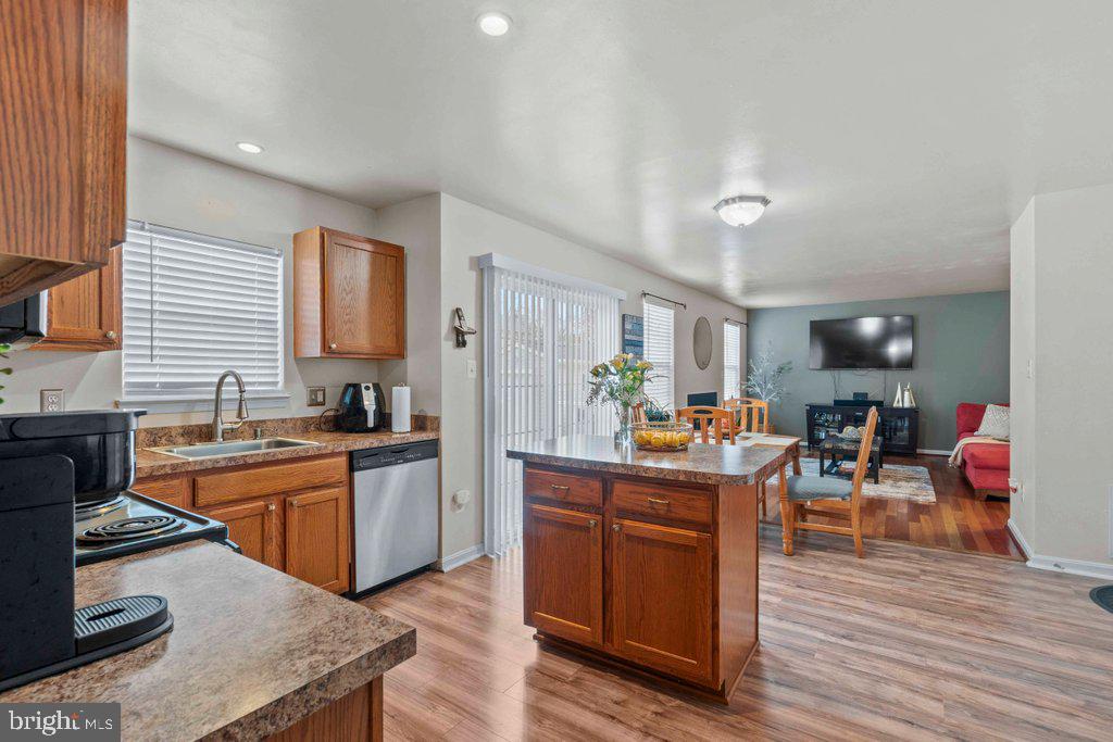 4305 Silver Spring Road Perry Hall, MD 21236 - Photo 18 of 48 a kitchen with stainless steel appliances granite countertop a stove and cabinets