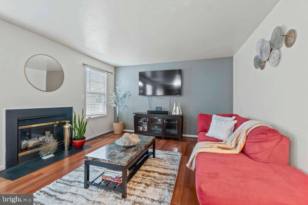 4305 Silver Spring Road Perry Hall, MD 21236 - Photo 21 of 48 a living room with furniture and a fireplace