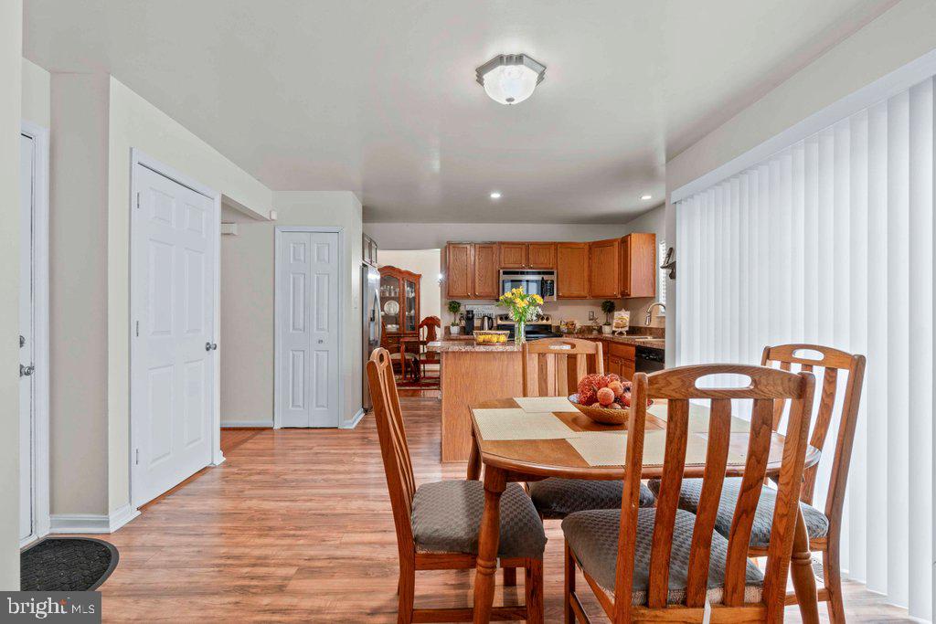 4305 Silver Spring Road Perry Hall, MD 21236 - Photo 22 of 48 a dining room with furniture and wooden floor