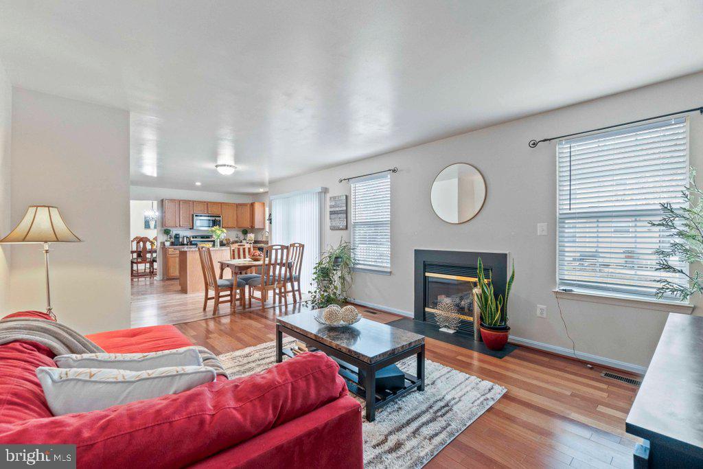 4305 Silver Spring Road Perry Hall, MD 21236 - Photo 23 of 48 a living room with furniture a fireplace and a window