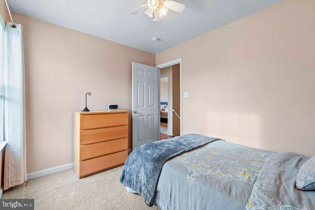 4305 Silver Spring Road Perry Hall, MD 21236 - Photo 30 of 48 a bedroom with a bed and a chandelier