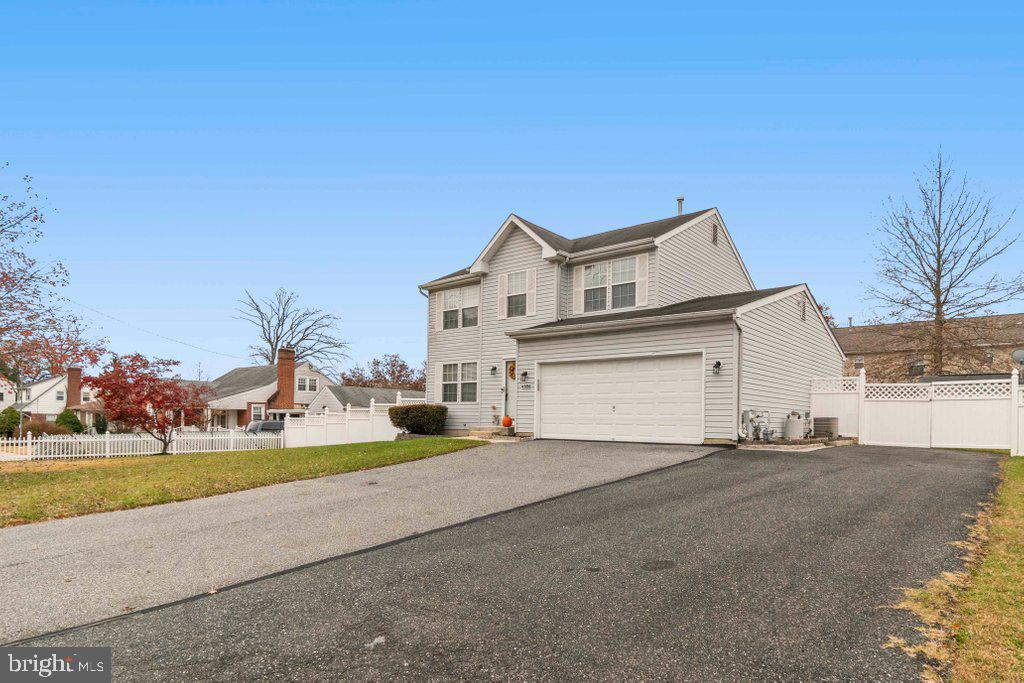4305 Silver Spring Road Perry Hall, MD 21236 - Photo 3 of 48 a view of a house with a yard and garage