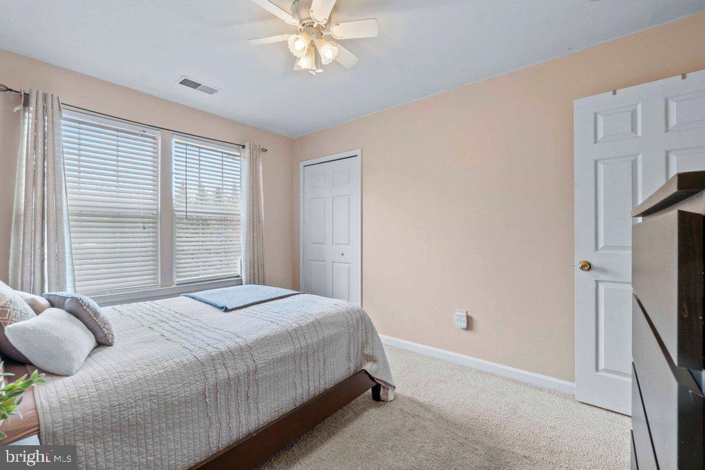 4305 Silver Spring Road Perry Hall, MD 21236 - Photo 35 of 48 a bedroom with a bed dresser and a flat tv screen