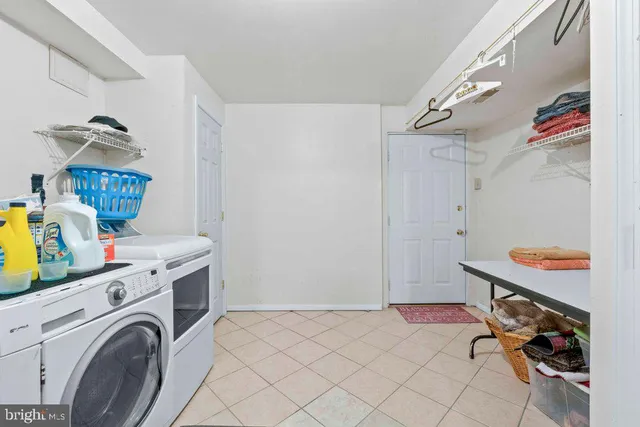 a view of a storage & utility room with washer and dryer