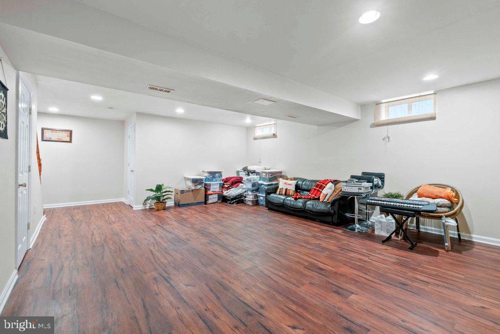4305 Silver Spring Road Perry Hall, MD 21236 - Photo 41 of 48 a view of a room with furniture and wooden floor