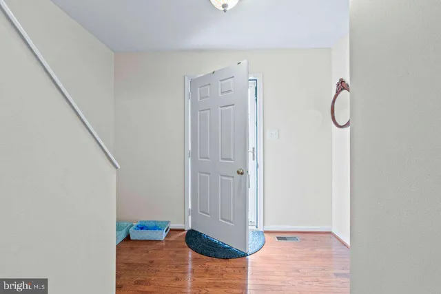 a view of entryway with wooden floor