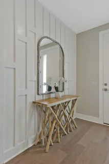 a dining room with furniture and wooden floor