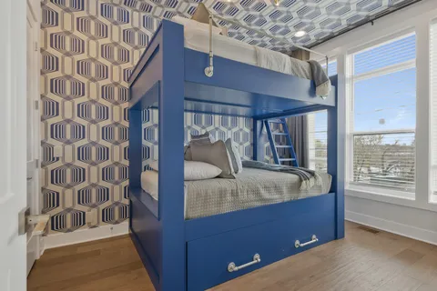 a en suite bathroom with a granite countertop sink and a tub