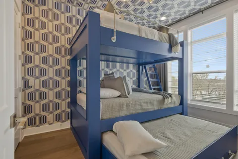 a bedroom with a bed and window